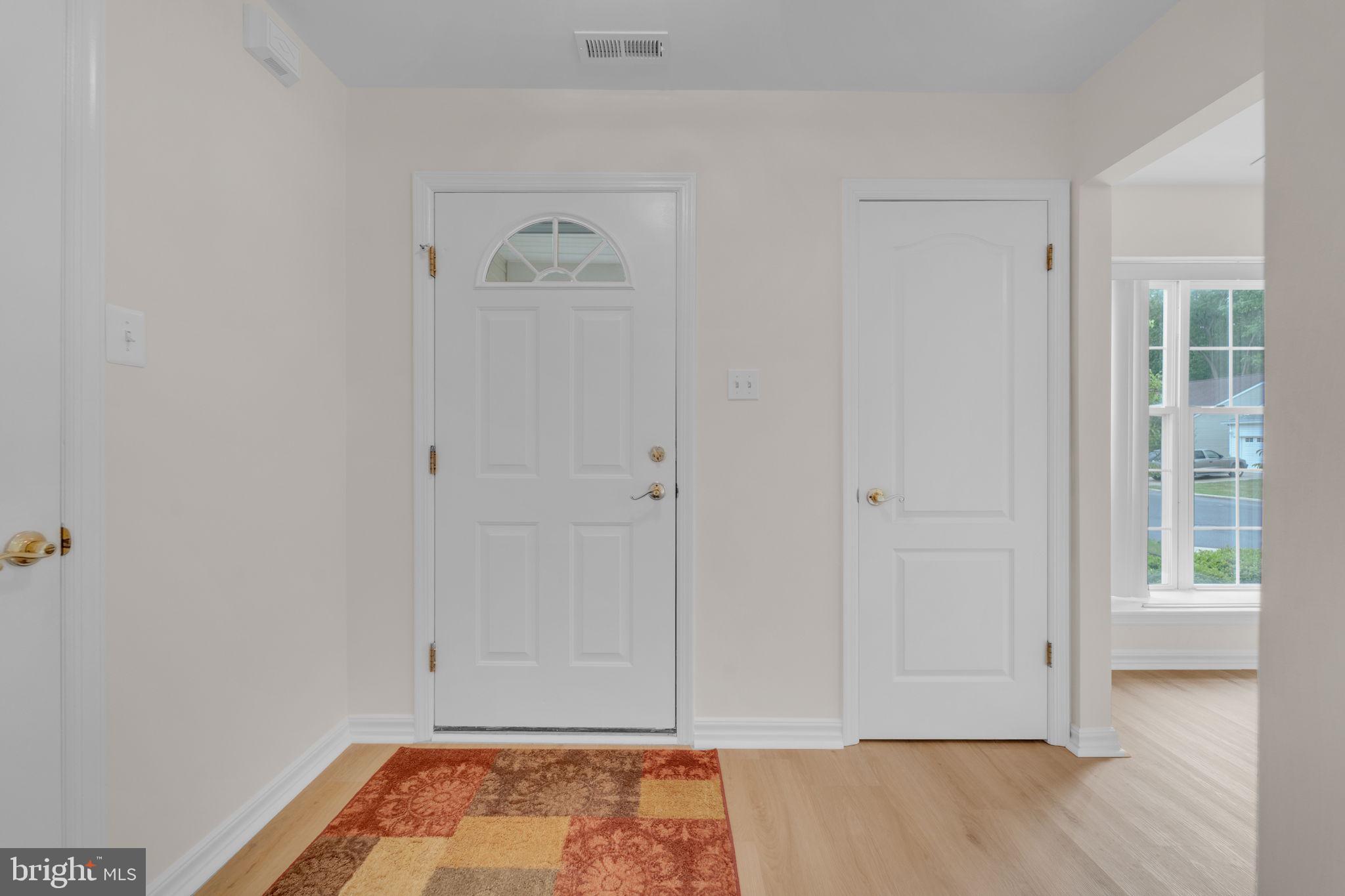 801 Freeport Way Williamstown, NJ 08094 - Photo 4 of 29 a view of room with window and wooden floor