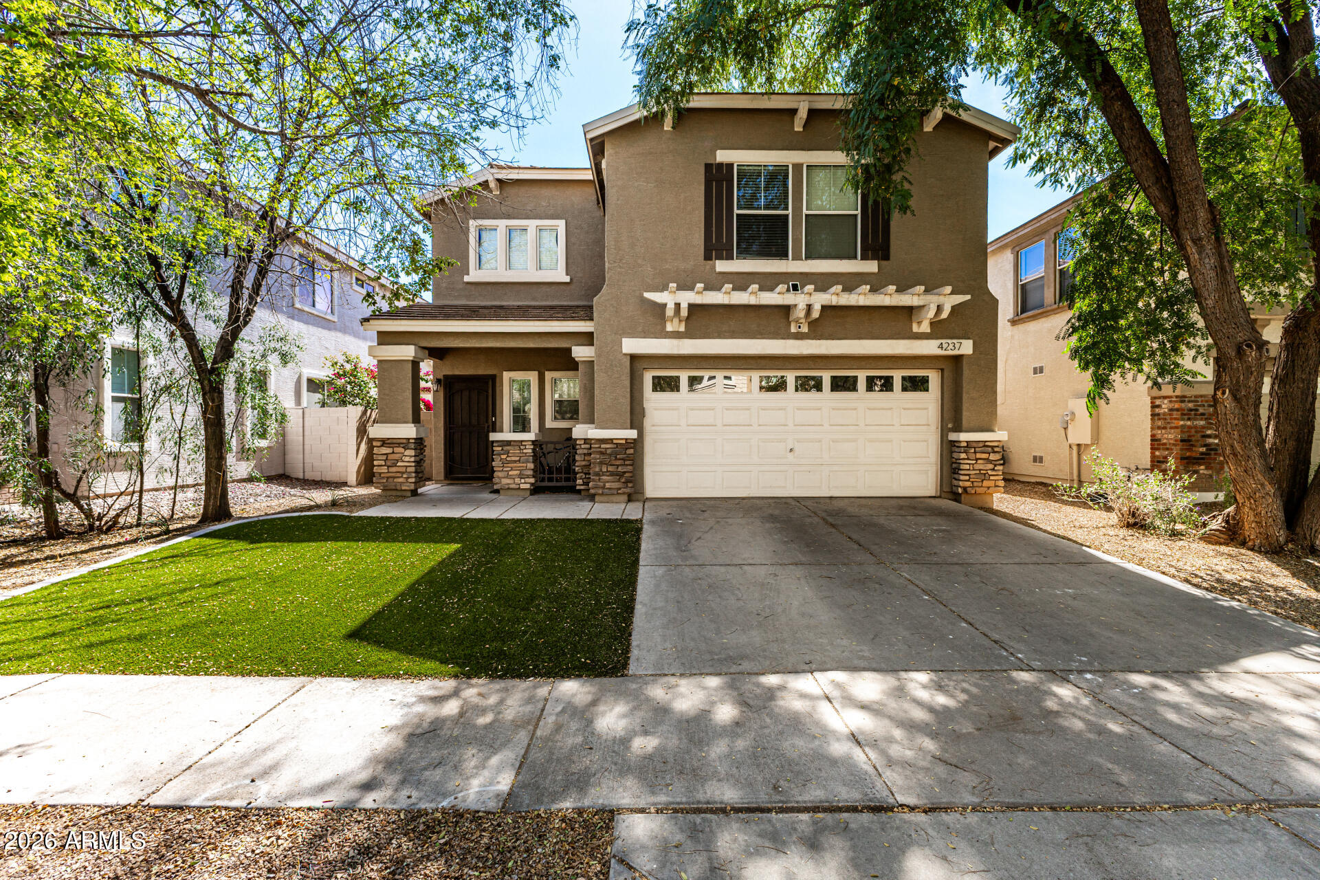 4237 East Orchid Lane Gilbert, AZ 85296 - Photo 1 of 33 a view of a building with a yard