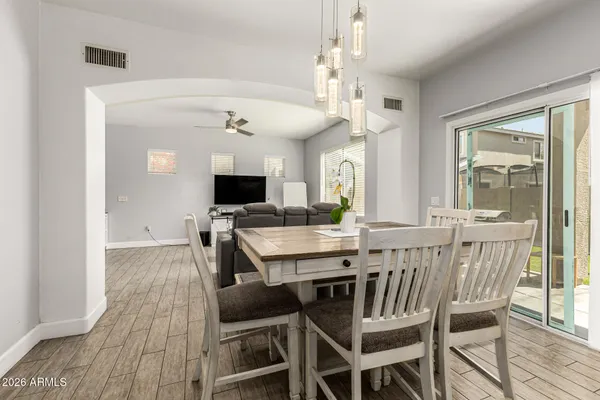 a view of a dining room with furniture window and wooden floor