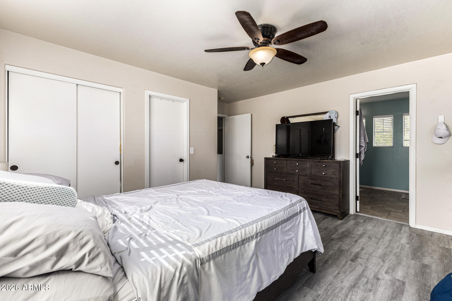 4237 East Orchid Lane Gilbert, AZ 85296 - Photo 19 of 33 a bedroom with a bed and a flat screen tv