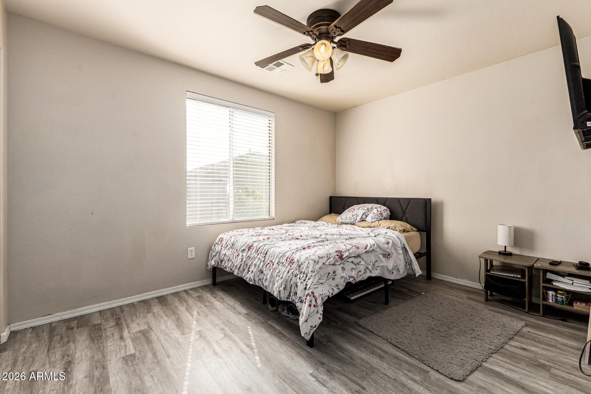 4237 East Orchid Lane Gilbert, AZ 85296 - Photo 25 of 33 a bedroom with a bed and a ceiling fan