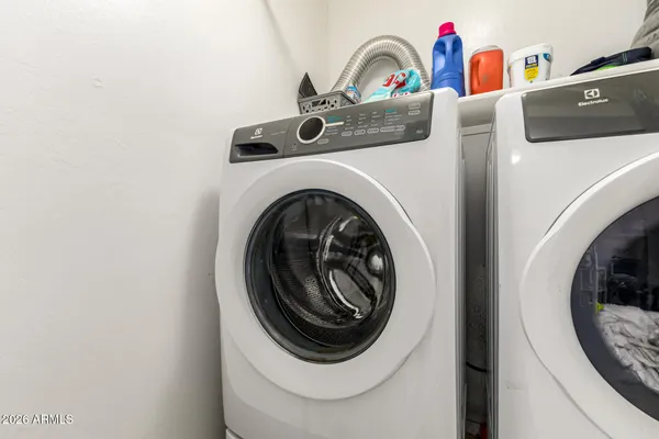a utility room with dryer and washer