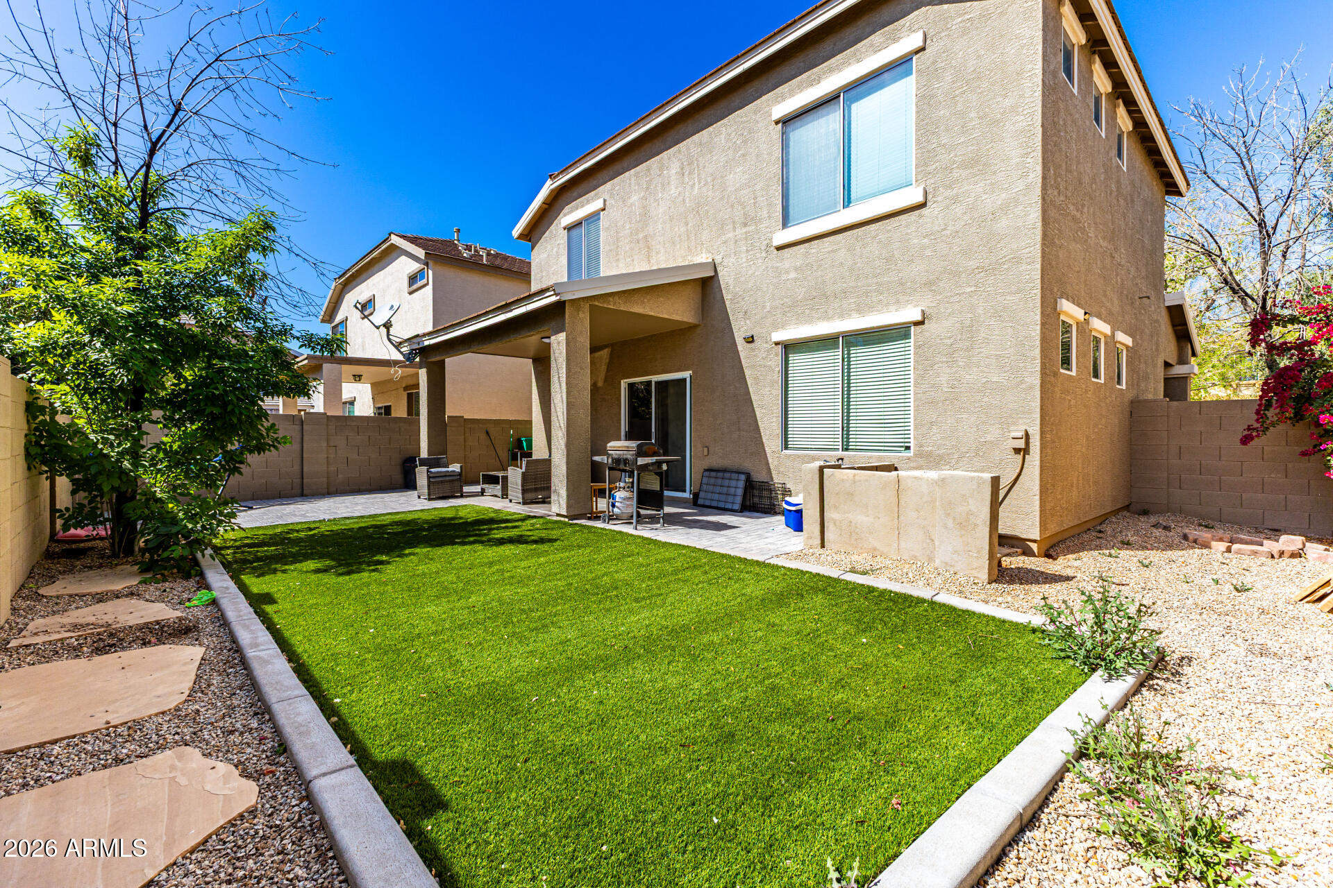4237 East Orchid Lane Gilbert, AZ 85296 - Photo 32 of 33 a view of a house with backyard and porch