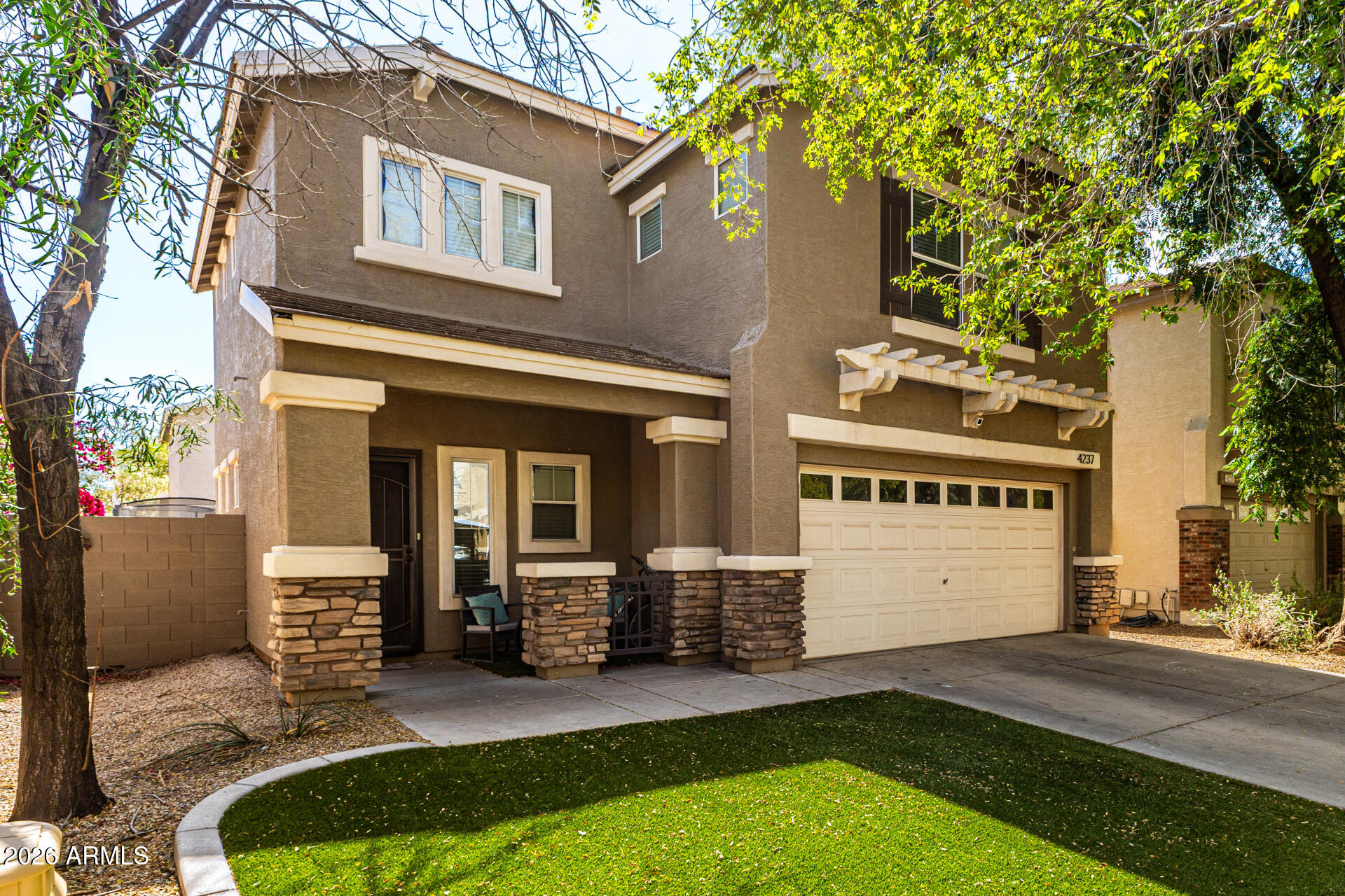 4237 East Orchid Lane Gilbert, AZ 85296 - Photo 4 of 33 a view of a house with a patio