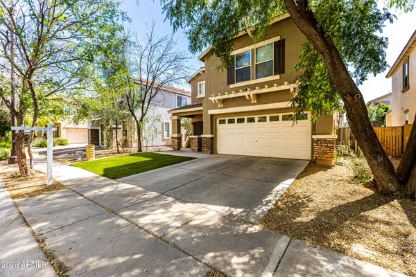 a view of a house with a yard