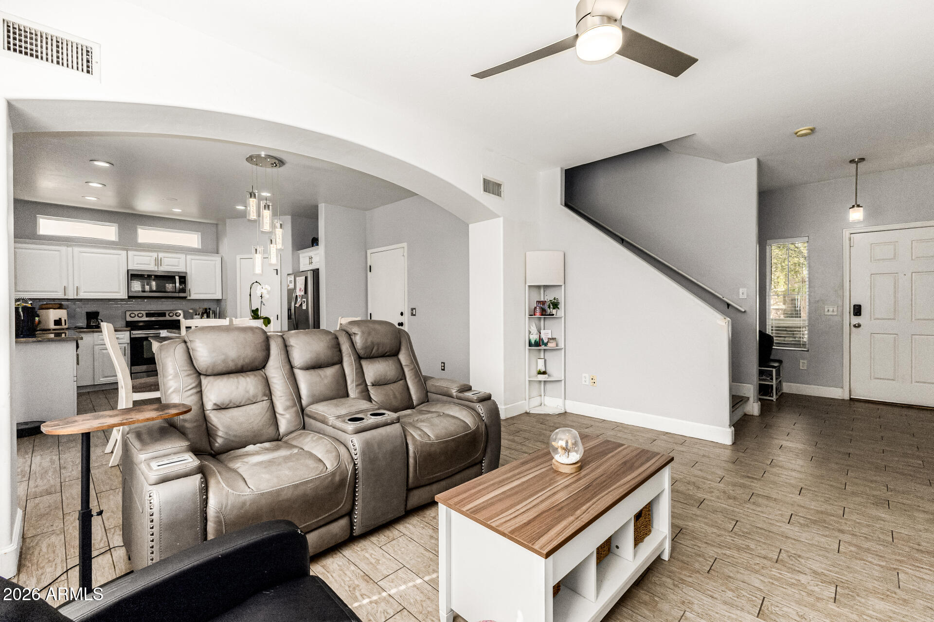 4237 East Orchid Lane Gilbert, AZ 85296 - Photo 10 of 33 a living room with furniture and kitchen view
