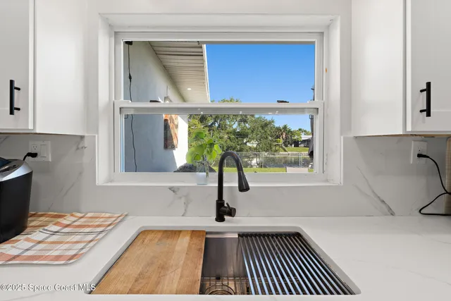 a kitchen with a sink and a window