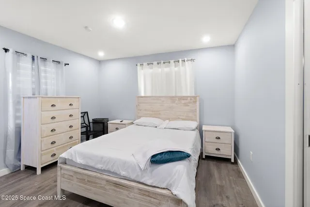a bedroom with a bed and a closet