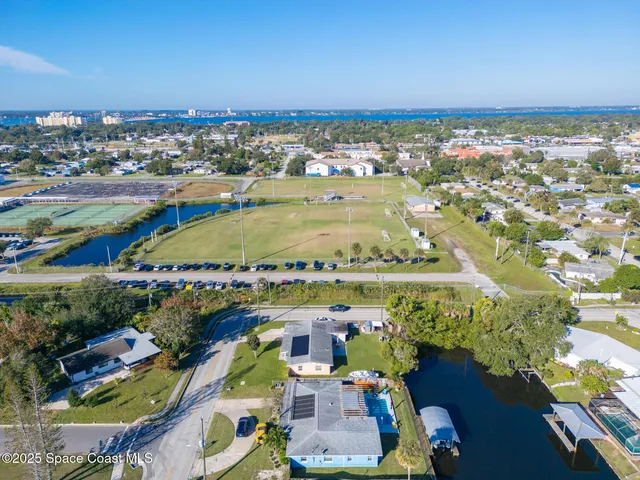 an aerial view of residential houses with outdoor space