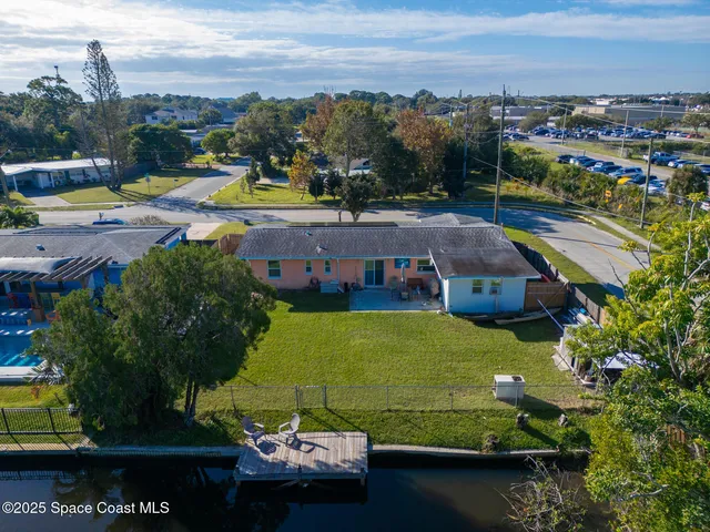 an aerial view of a house with outdoor space