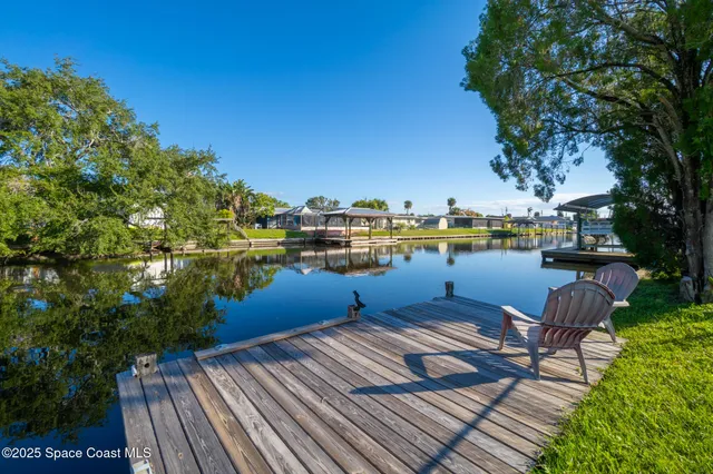 a roof deck with outdoor seating and yard