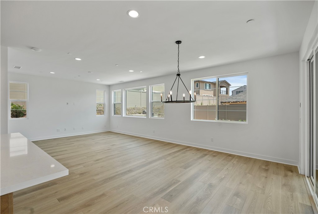 3070 Rue De Latour Vista, CA 92084 - Photo 4 of 22 Large great room, wood floors