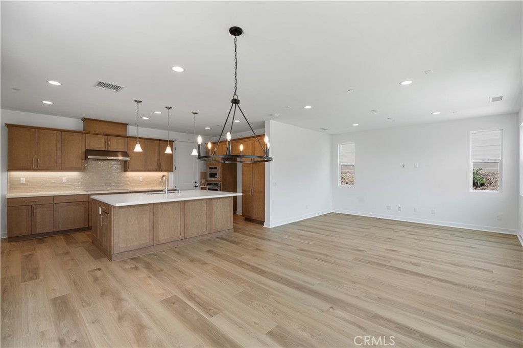 3070 Rue De Latour Vista, CA 92084 - Photo 6 of 22 Large great room, wood floors