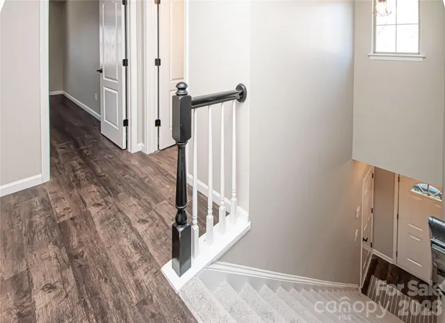 a kitchen with stainless steel appliances granite countertop a refrigerator and a stove