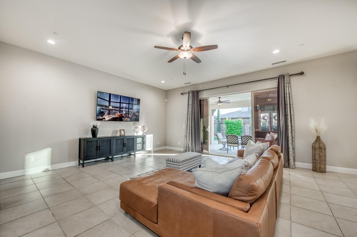598 Crescent Lane Madera, CA 93636 - Photo 16 of 80 a living room with furniture and a large window