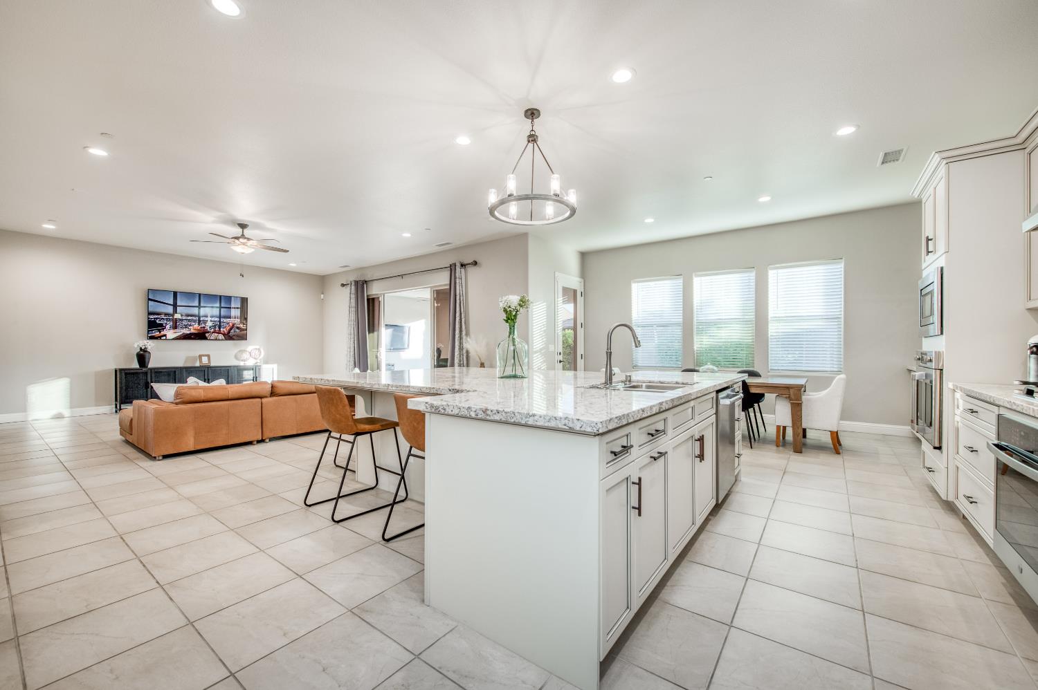 598 Crescent Lane Madera, CA 93636 - Photo 22 of 80 a kitchen with stainless steel appliances granite countertop a sink and a refrigerator