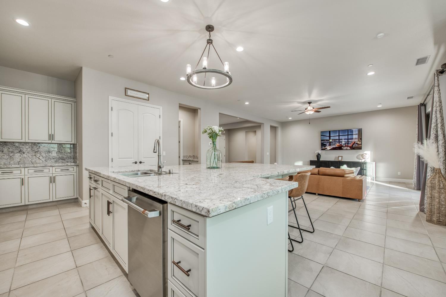 598 Crescent Lane Madera, CA 93636 - Photo 25 of 80 a kitchen with stainless steel appliances granite countertop a sink and cabinets
