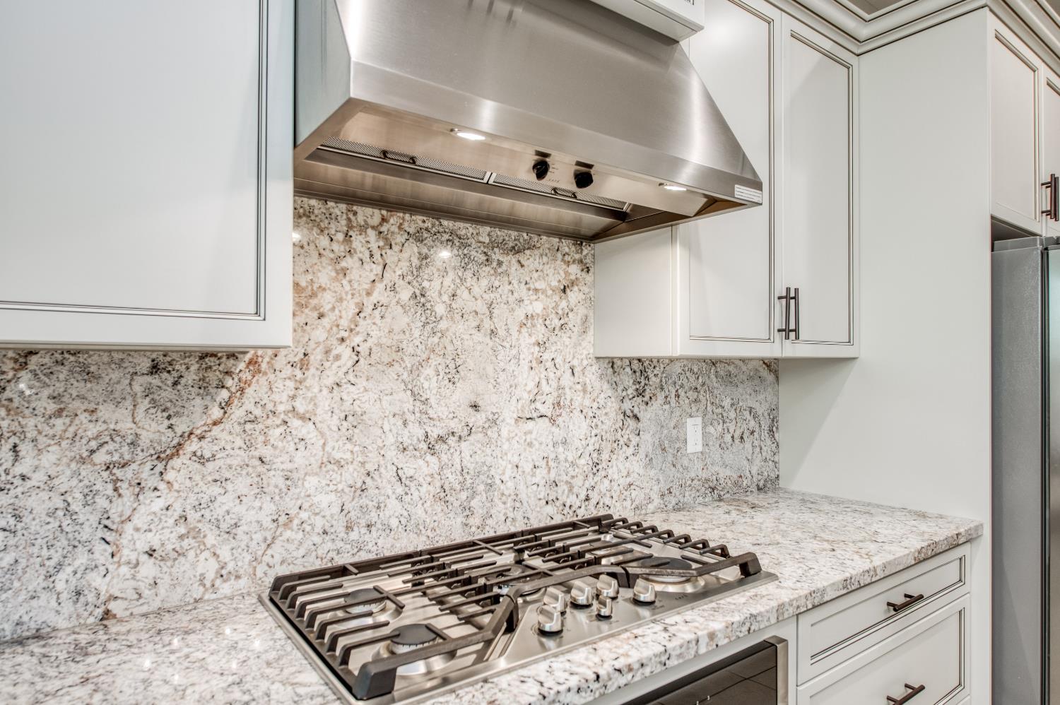 598 Crescent Lane Madera, CA 93636 - Photo 26 of 80 a stove top oven sitting inside of a kitchen