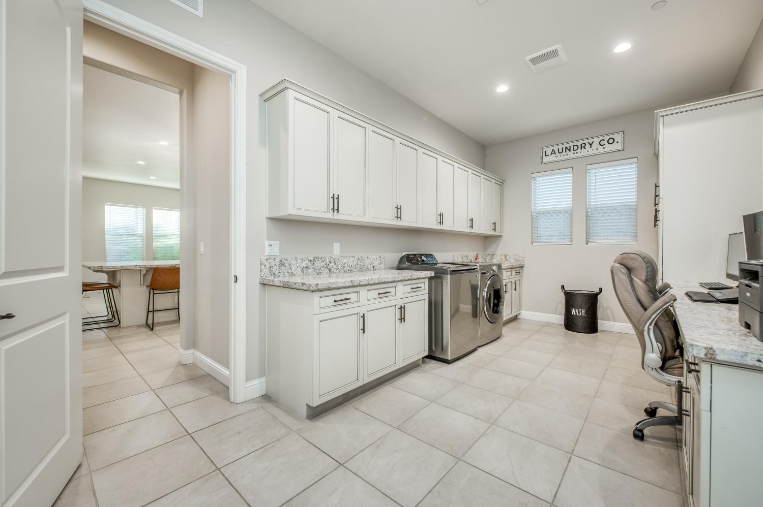 598 Crescent Lane Madera, CA 93636 - Photo 33 of 80 a kitchen with a sink window and cabinets