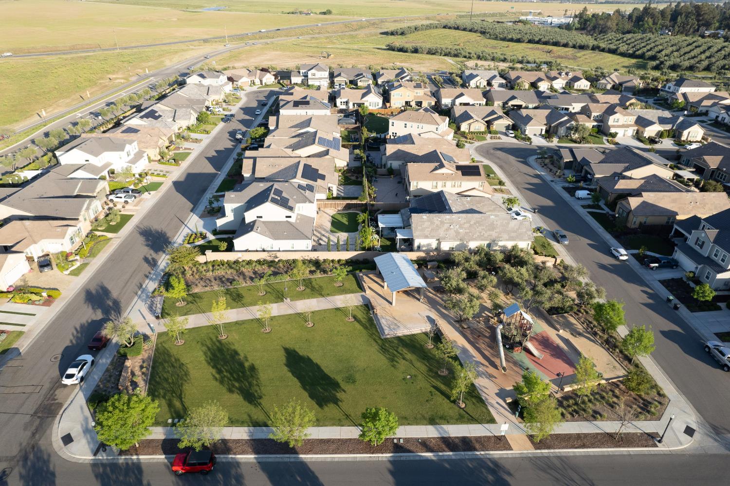 598 Crescent Lane Madera, CA 93636 - Photo 69 of 80 an aerial view of a residential building and an ocean view