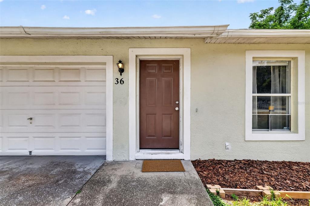 36 Bay Ridge Loop Mascotte, FL 34753 - Photo 6 of 32 a view of front door of a house
