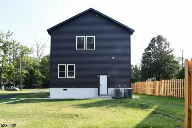 a house that has a big yard in front of it