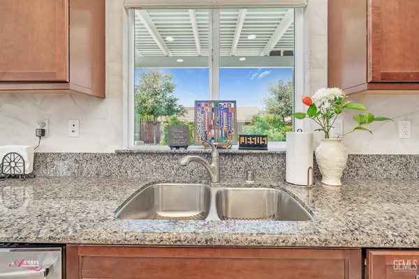 a bedroom with a bed dresser and a window
