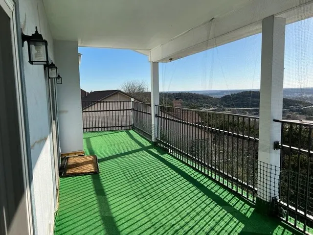 a view of a balcony with a swing
