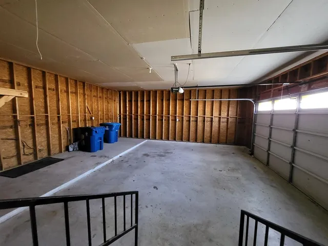 a view of an empty room with stairs