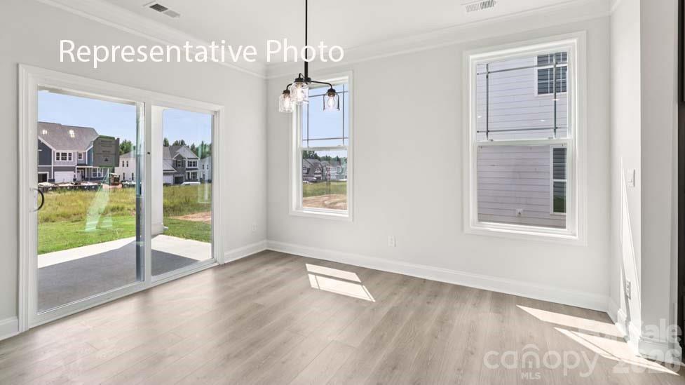 7601 Bainbridge Road Sherrills Ford, NC 28673 - Photo 11 of 34 a view of an entryway with wooden floor and windows