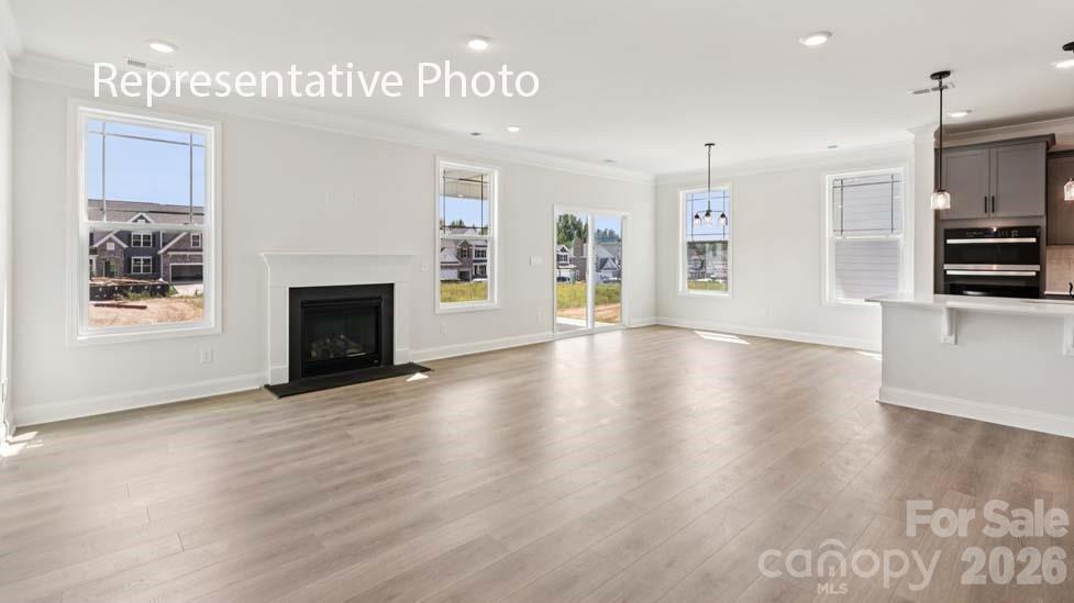 7601 Bainbridge Road Sherrills Ford, NC 28673 - Photo 15 of 34 a view of an empty room with window and fire place