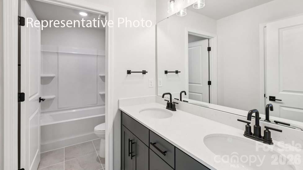 7601 Bainbridge Road Sherrills Ford, NC 28673 - Photo 23 of 34 a bathroom with a sink tub vanity and a mirror