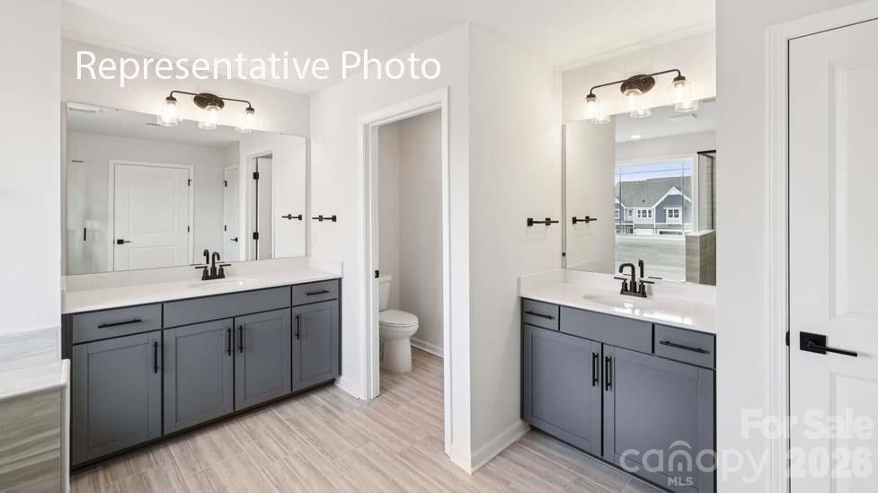 7601 Bainbridge Road Sherrills Ford, NC 28673 - Photo 27 of 34 a spacious bathroom with a double vanity sink mirror and