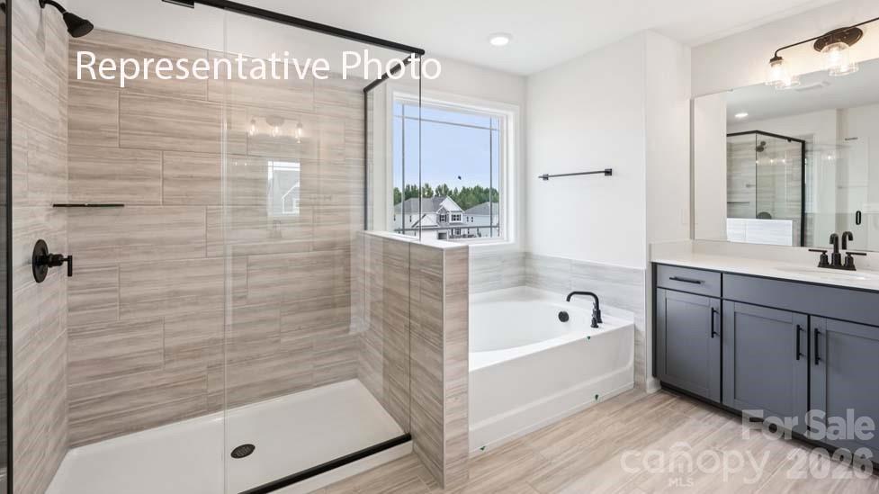 7601 Bainbridge Road Sherrills Ford, NC 28673 - Photo 28 of 34 a bathroom with a tub shower and sink