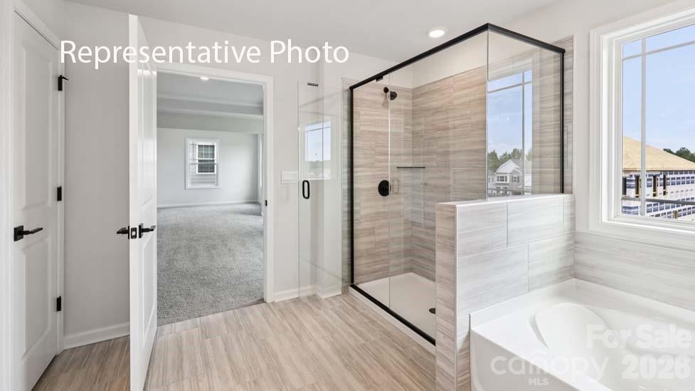 7601 Bainbridge Road Sherrills Ford, NC 28673 - Photo 29 of 34 a bathroom with a bathtub and a shower