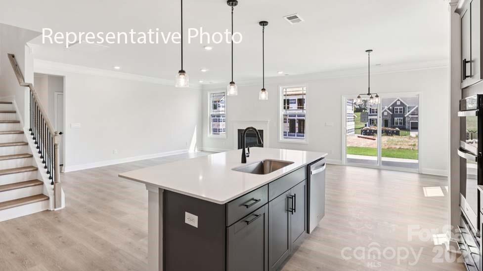 7601 Bainbridge Road Sherrills Ford, NC 28673 - Photo 5 of 34 a kitchen with a sink and a table