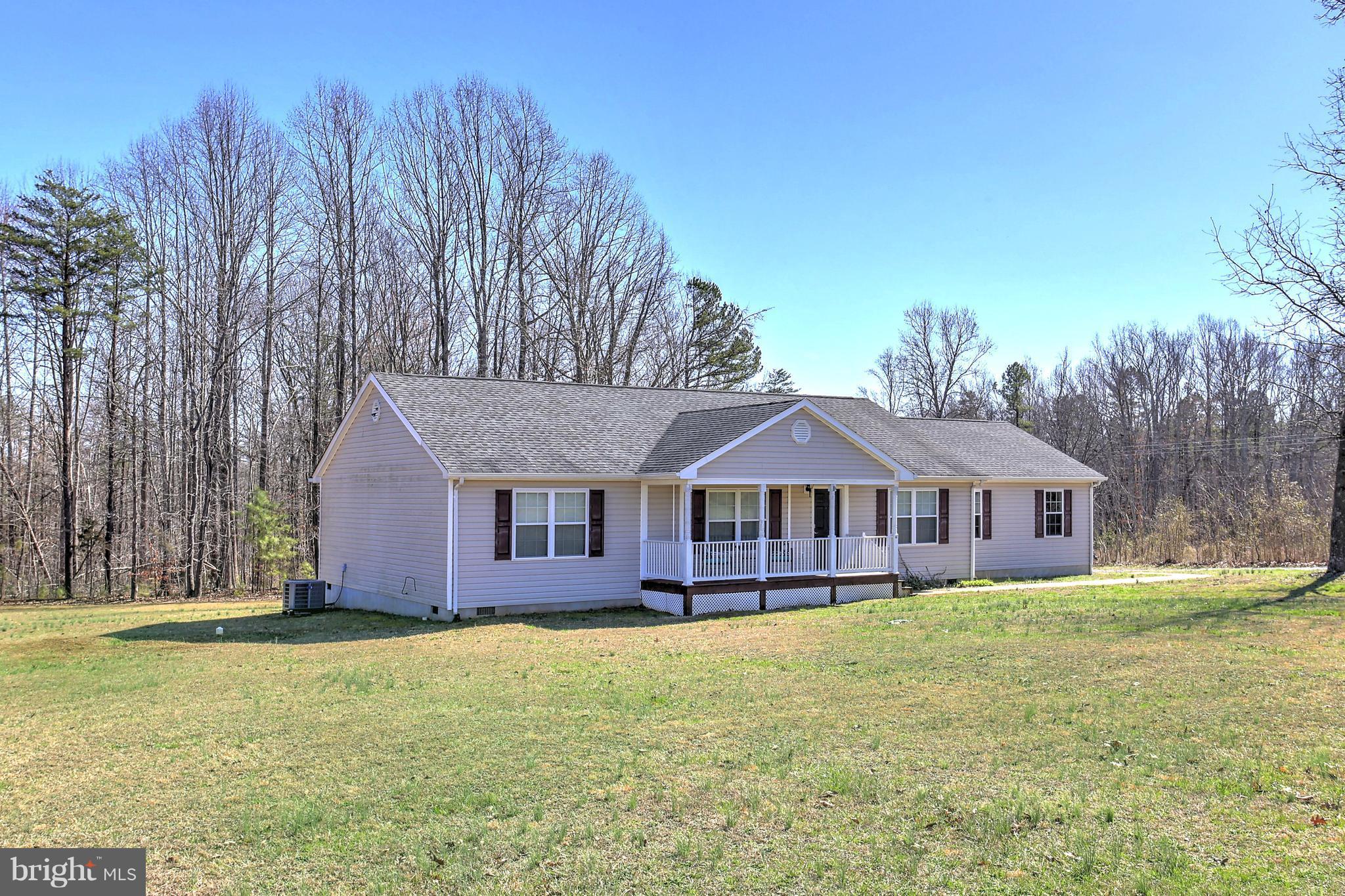 a house with trees in the background
