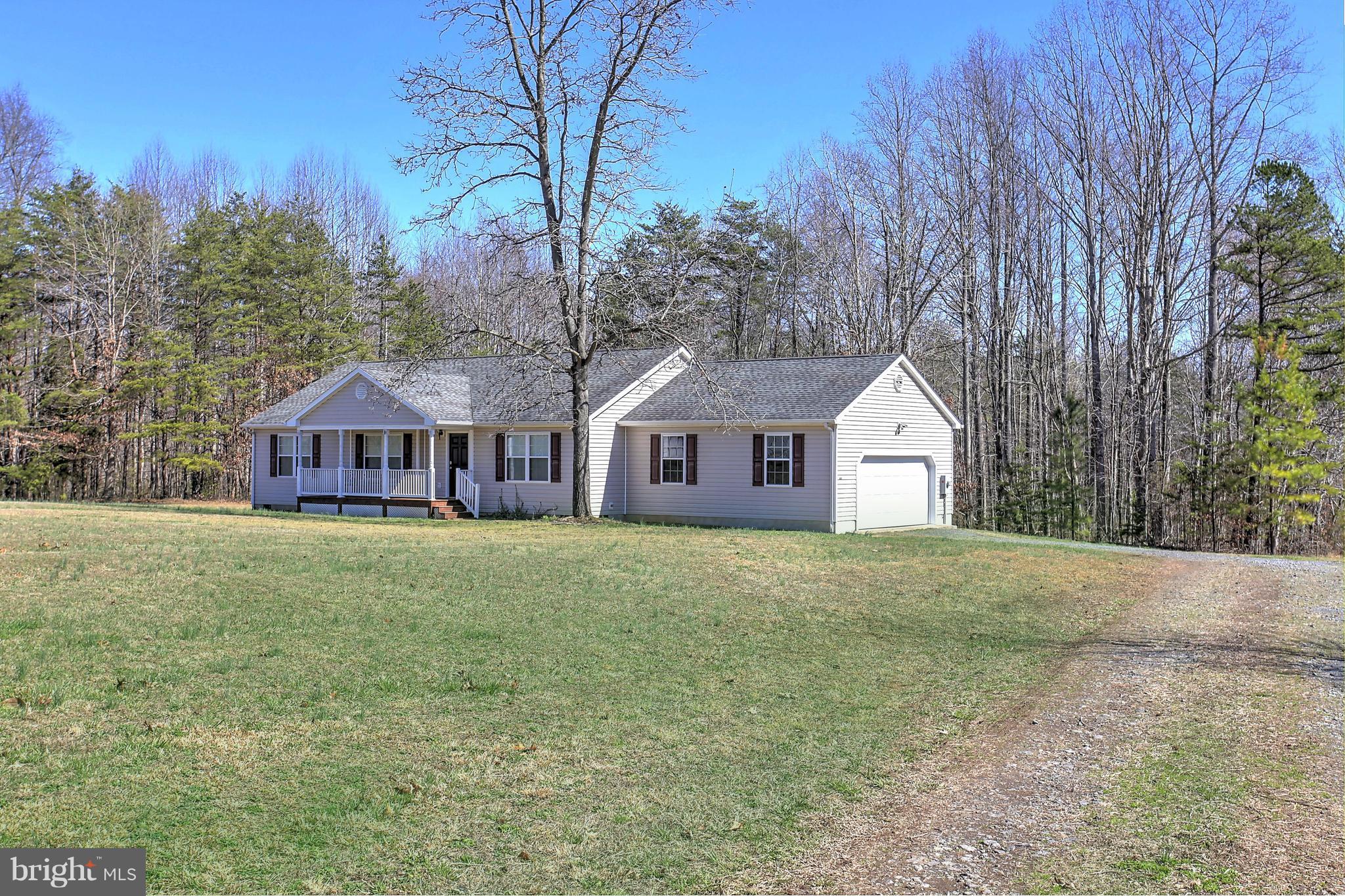 180 Spring Road Mineral, VA 23117 - Photo 2 of 22 a front view of a house with a yard and trees