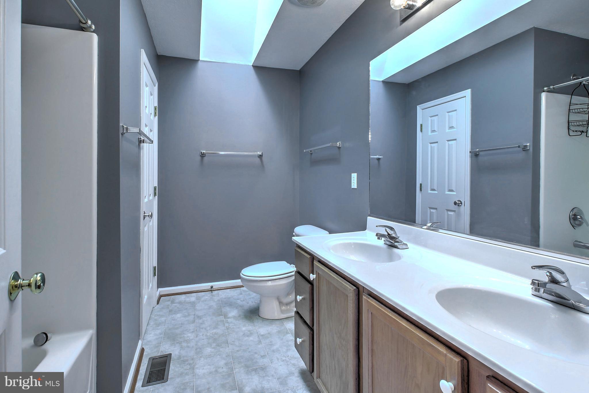 180 Spring Road Mineral, VA 23117 - Photo 12 of 22 a bathroom with a sink and a mirror