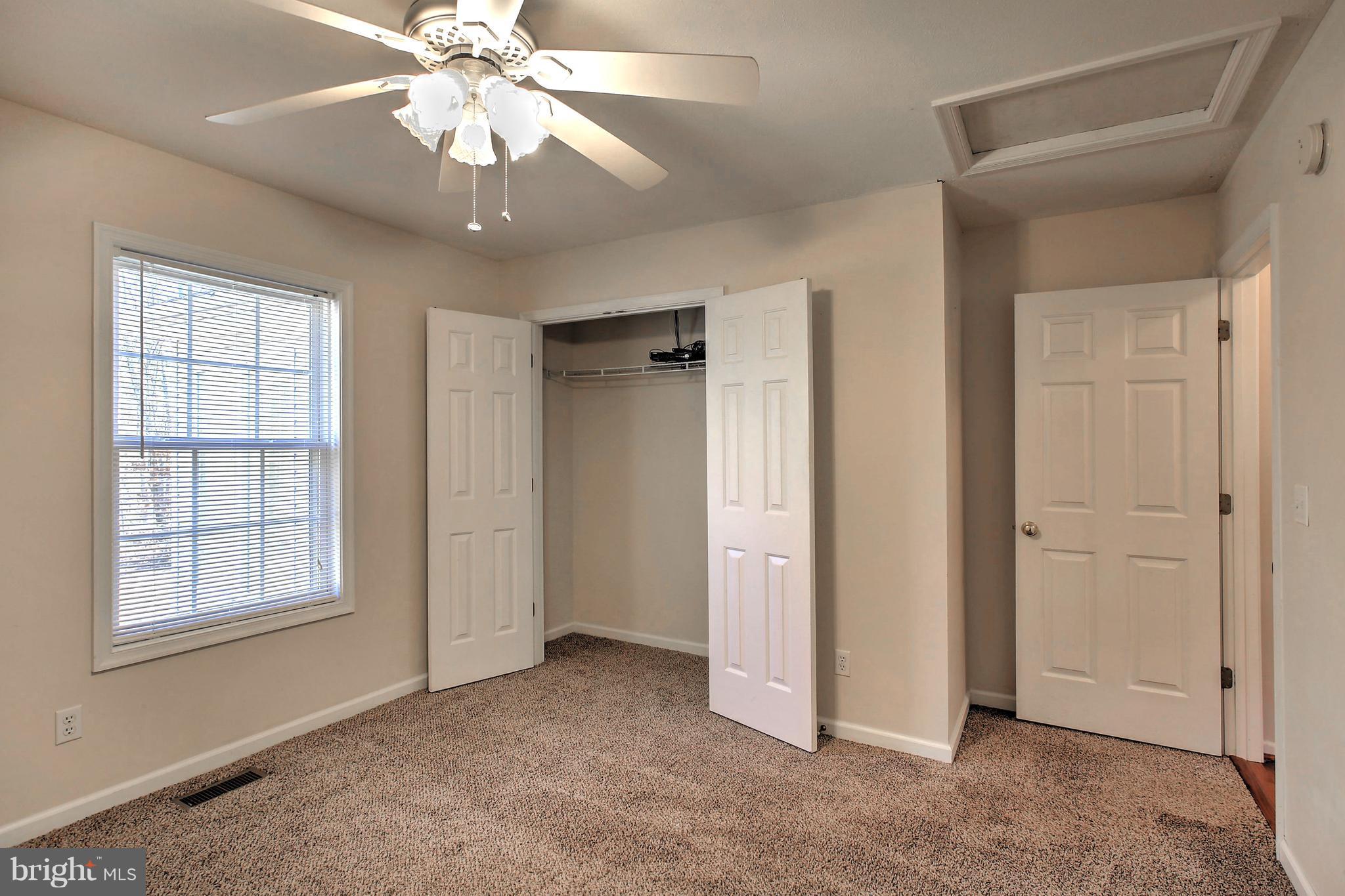 180 Spring Road Mineral, VA 23117 - Photo 13 of 22 an empty room with fan and windows