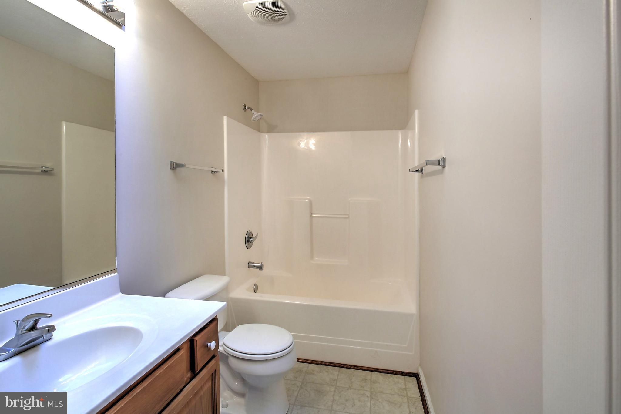 180 Spring Road Mineral, VA 23117 - Photo 14 of 22 a bathroom with a sink a toilet and shower