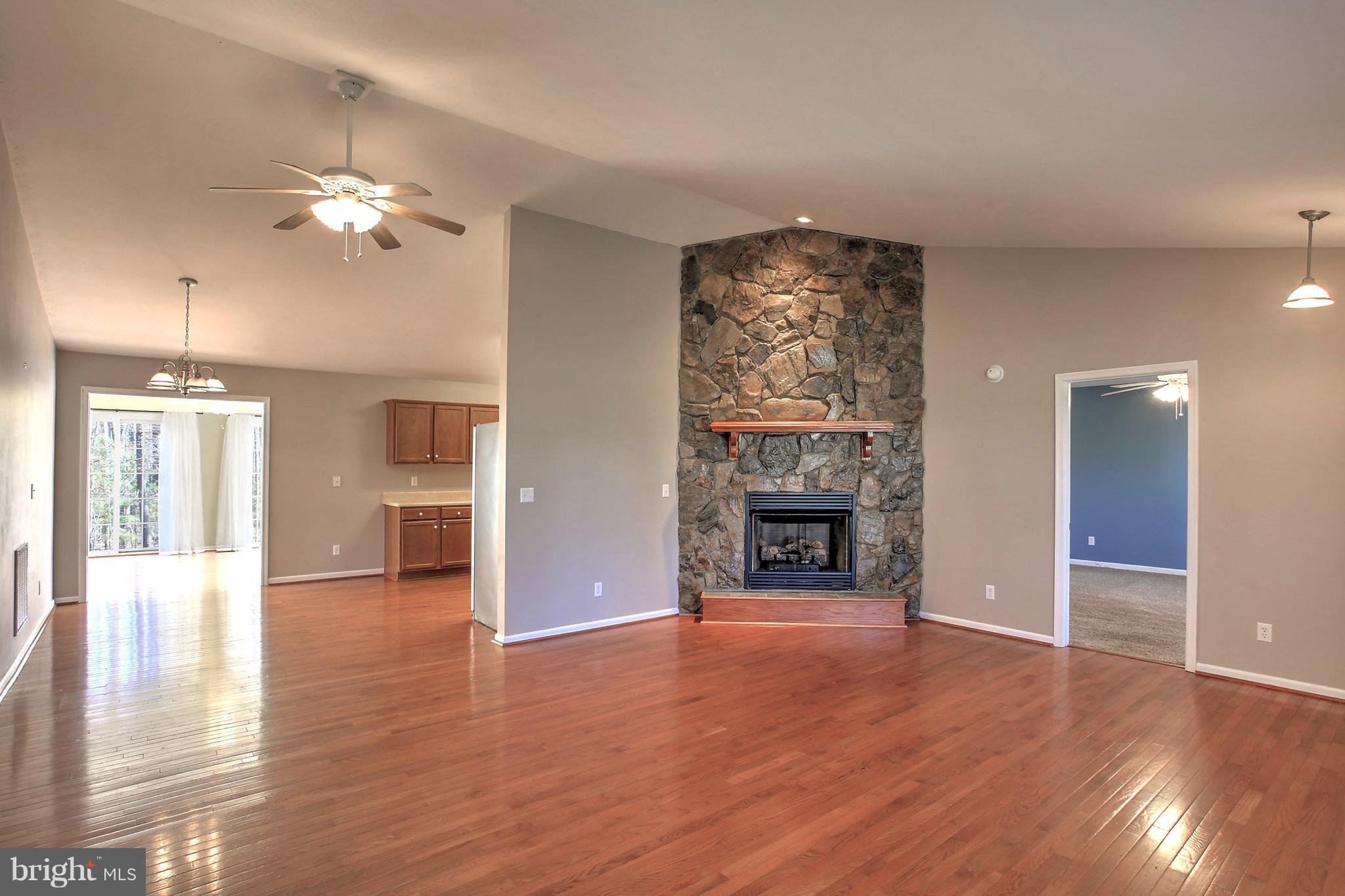 180 Spring Road Mineral, VA 23117 - Photo 4 of 22 a view of a livingroom with a ceiling fan window and wooden floor