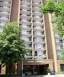 a building view with large windows and plants