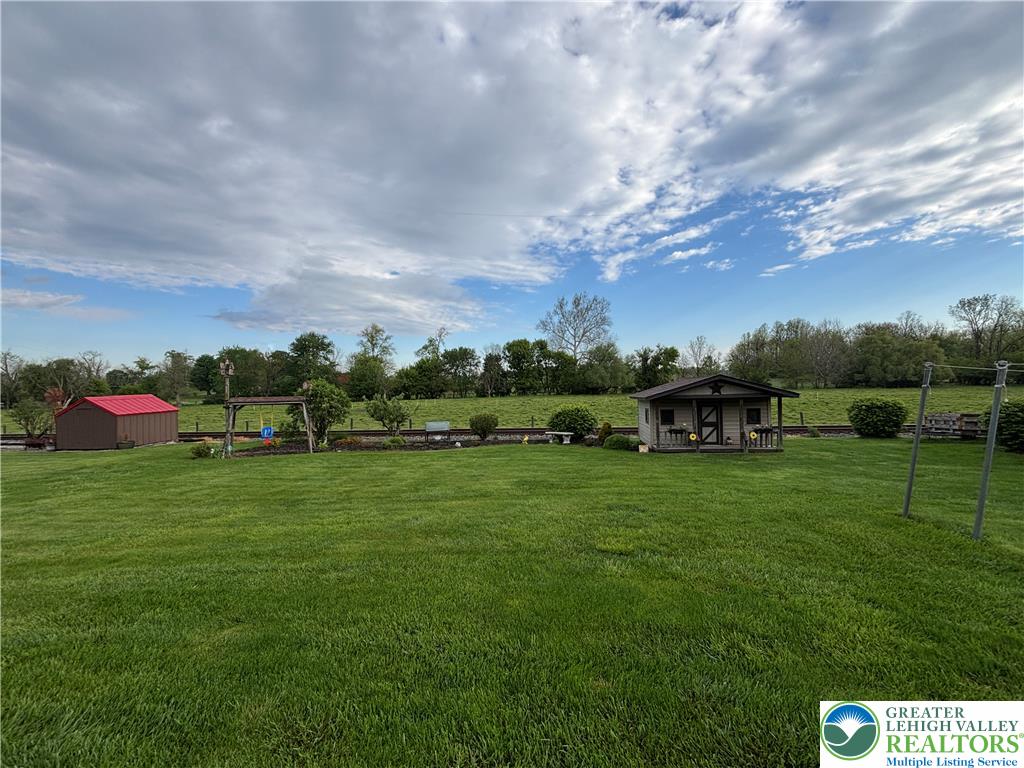 4938 Steuben Road Nazareth, PA 18064 - Photo 8 of 8 Expansive green yard with two charming outbuildings, perfect for storage and recreation.