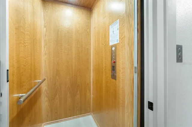 a bathroom with a shower curtain and a window