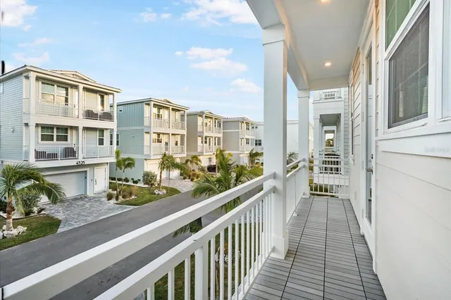 a view of a balcony with potted plants