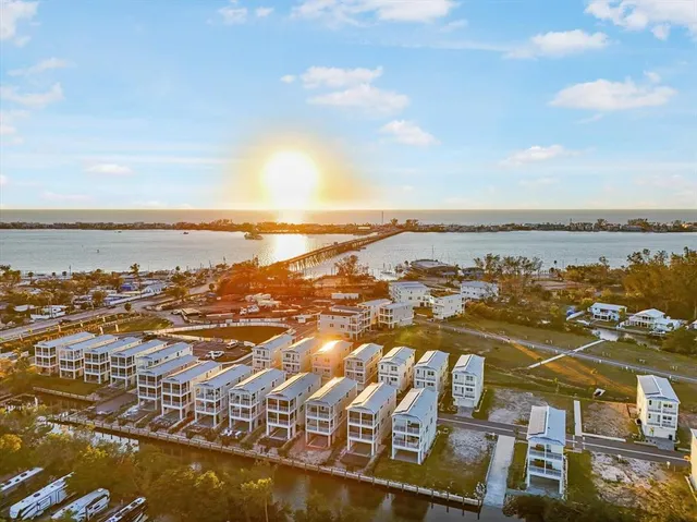 an aerial view of residential building and ocean