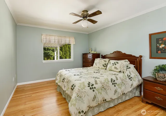 a bedroom with bed and window