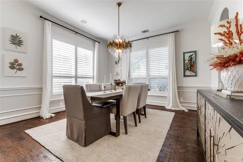 a view of a dining room with furniture and window