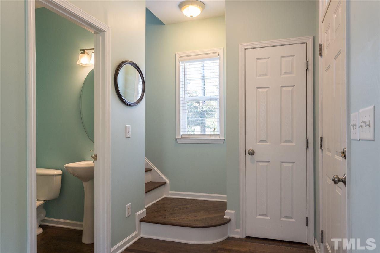 233 Cooke Street Raleigh, NC 27601 - Photo 13 of 27 Back inside, in the front entryway, there is a powder room for guests, and then it's off to upstairs.